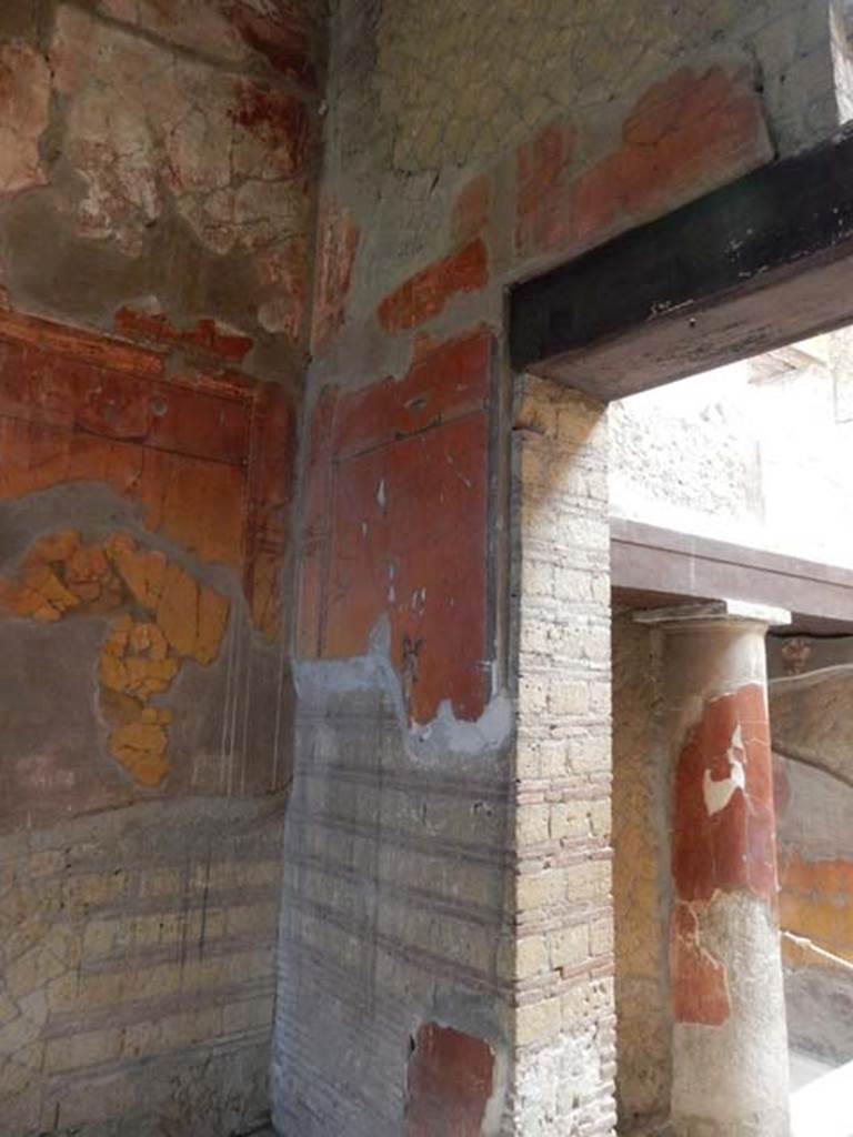 V.8 Herculaneum, May 2018. Room 7, looking towards north wall in north-west corner with painted cupid.
Photo courtesy of Buzz Ferebee.